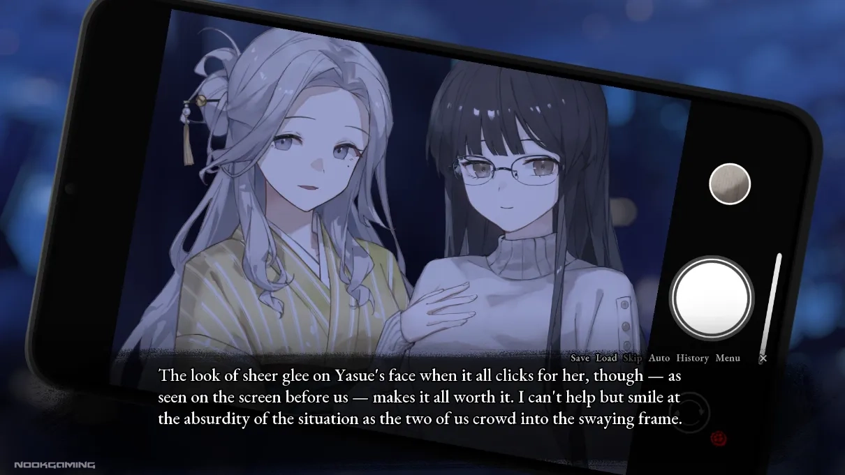 Yasue and Honoka taking a selfie in A Tithe in Blood