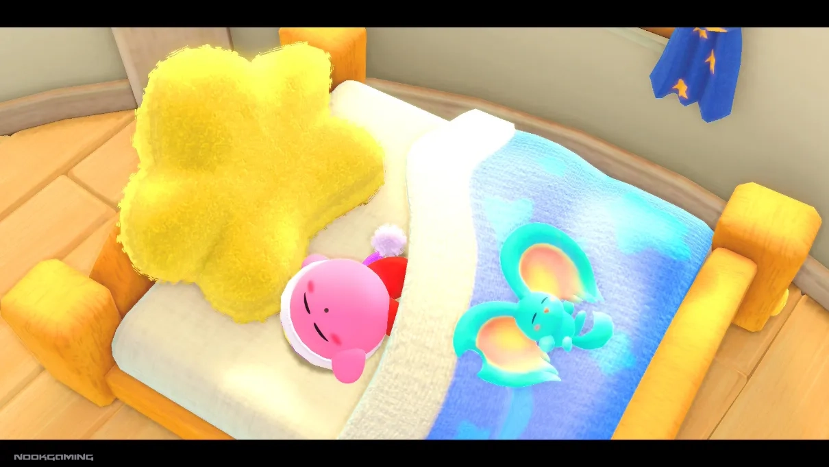 Kirby sleeping on a bed